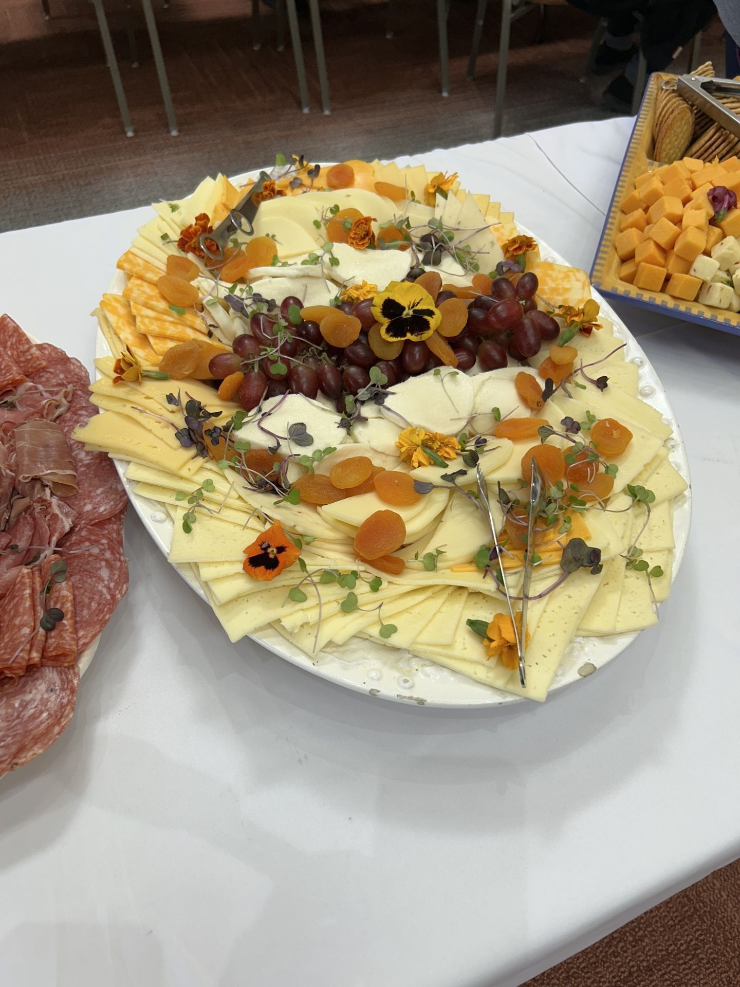 Beautifully arranged sliced cheese tray